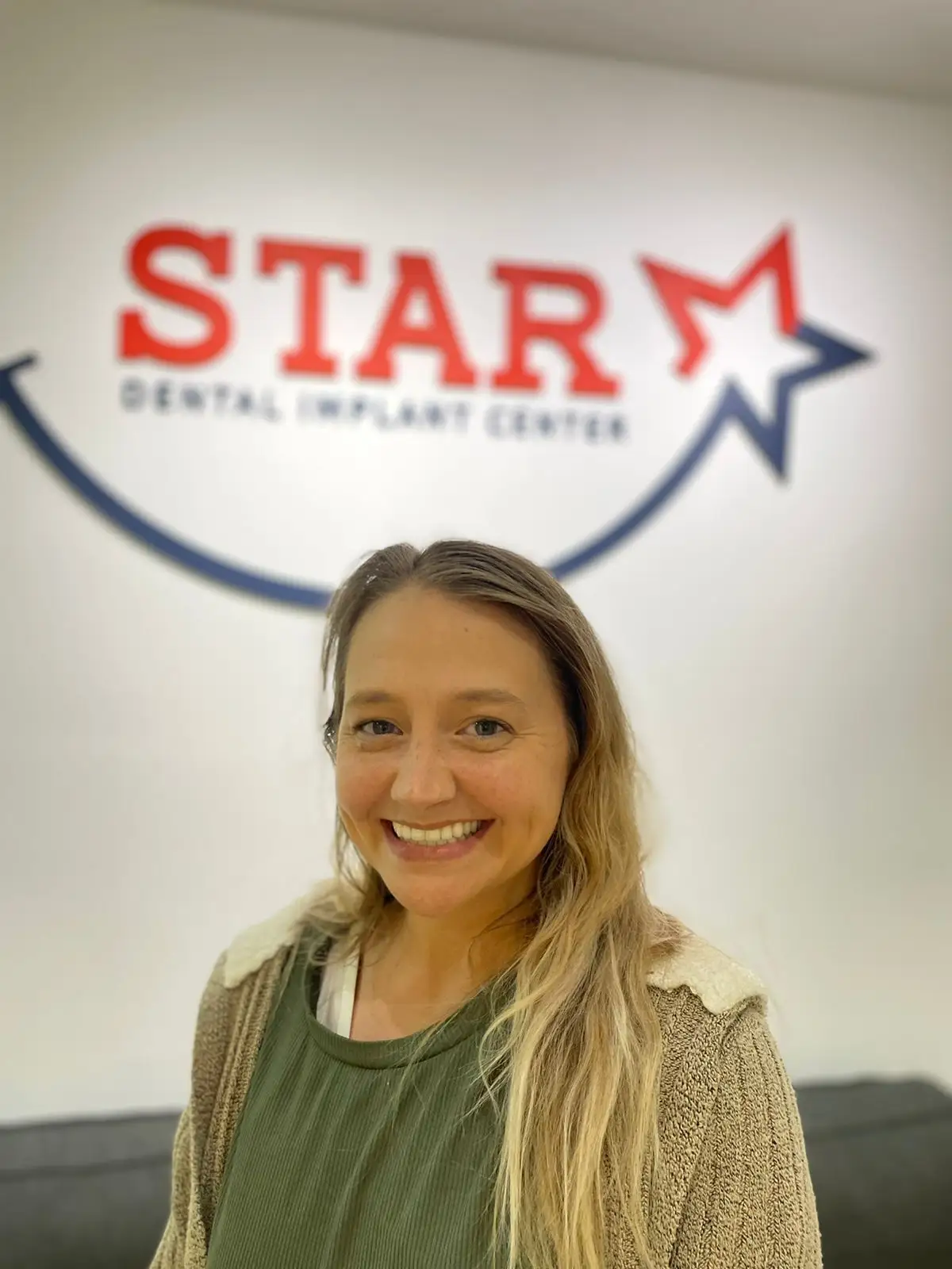 Smiling woman at STAR Dental Implant Center