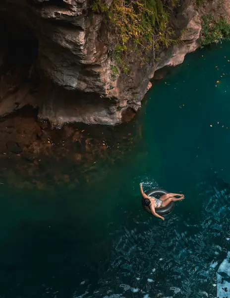 Person swimming in natural cenote